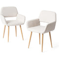 Deux chaises scandinaves en tissu beige avec dossier ouvert et pieds en metal, design raffine pour chambre ou repas